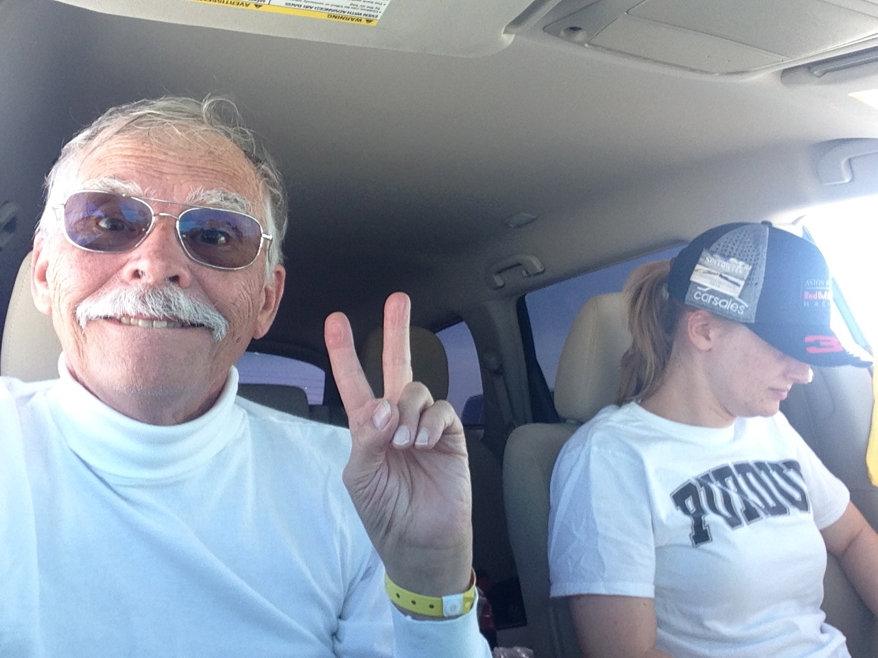 Peace sign from Smitty with Amy sitting in the Pathfinder at Bonneville